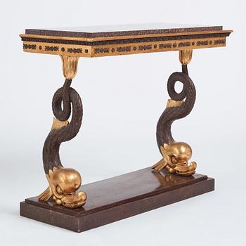 A Swedish Empire porphyry and giltwood console table, early 19th century.