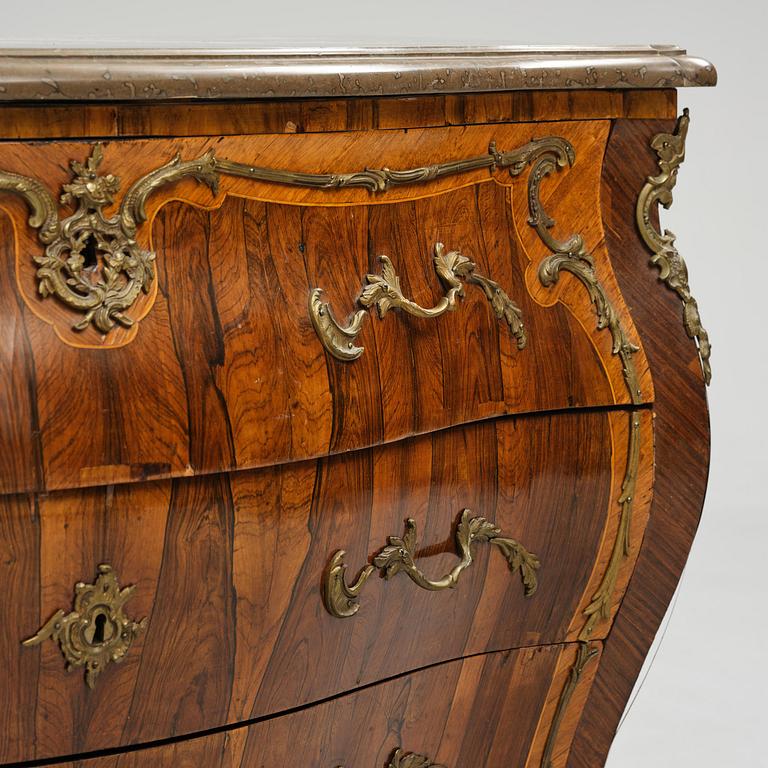 A rococo parquetry commode by C. G. Willkom (master in Stockholm 1763-65).