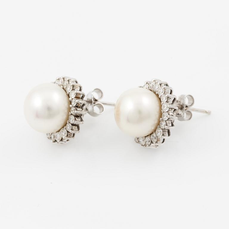 Earrings, a pair, 18K white gold with cultured pearls and brilliant-cut diamonds.