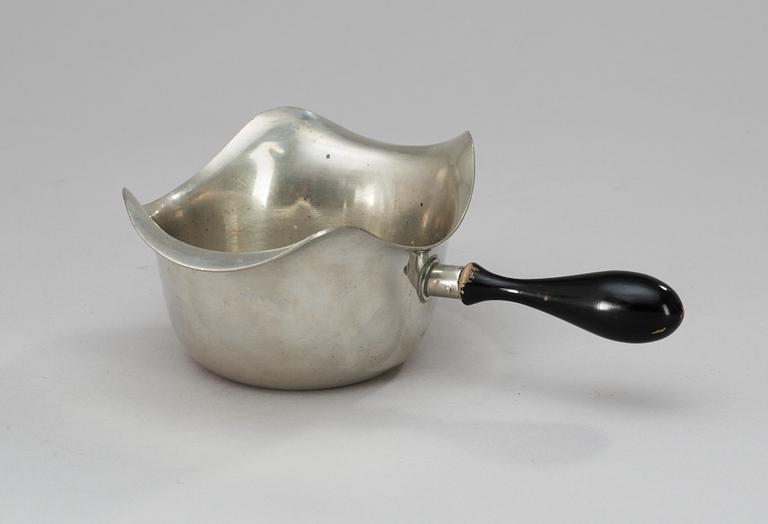 A pewter sauce-boat with a black wooden handle, Firma Svenskt Tenn 1948.