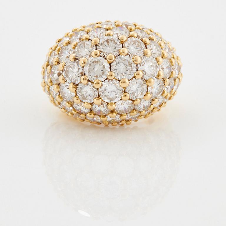 Cartier "Marrakech" an 18K gold bombé ring set with round brilliant-cut diamonds.