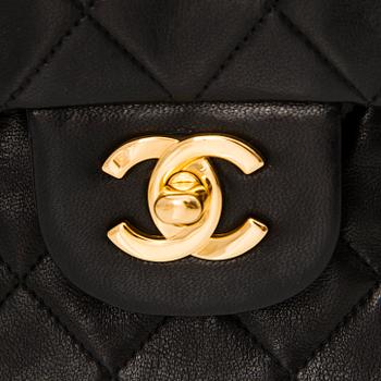 A Black Double Flap Bag.