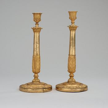 A pair of Empire early 19th century candlesticks.