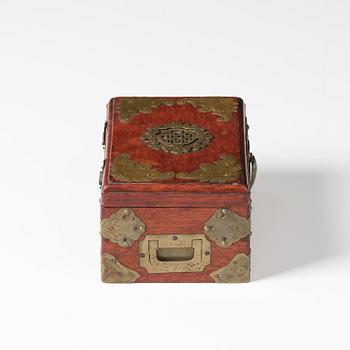 A Hongmu chest with brass mounts, late Qing dynasty.