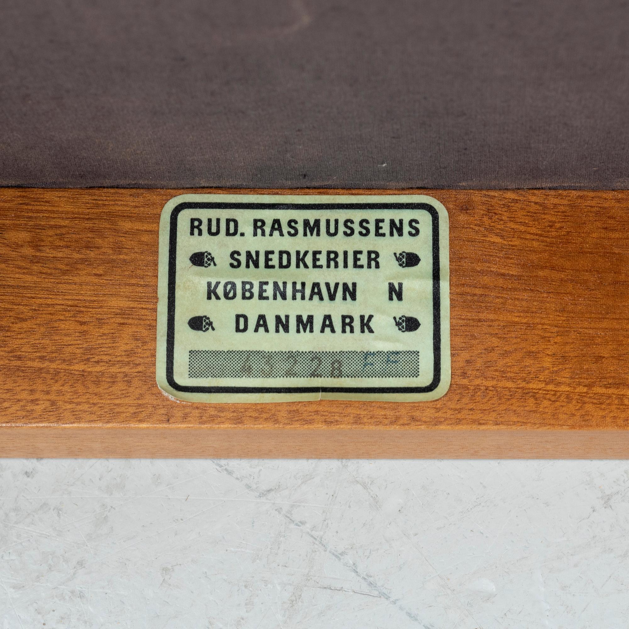 Kaare Klint, a pair of mahogany and natural leather 'Fabourg Chairs', Rud. Rasmussen, Denmark, late 20th Century. .