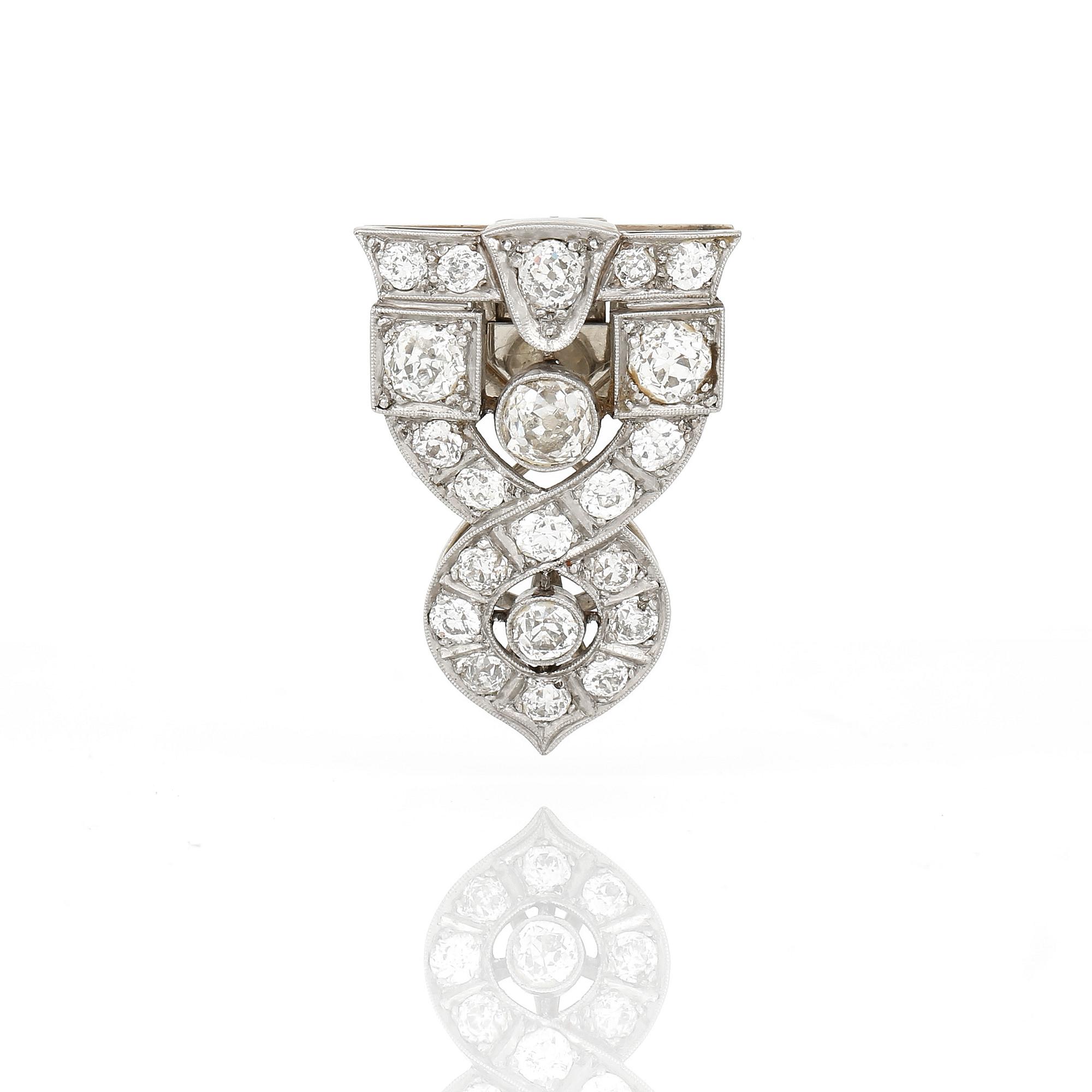 CLIPP/BROSCH, 14K vitguld med gammalslipade diamanter, tot ca 2,87 ct, Nederländerna, 1906-1953. Total vikt ca 8,48 g.