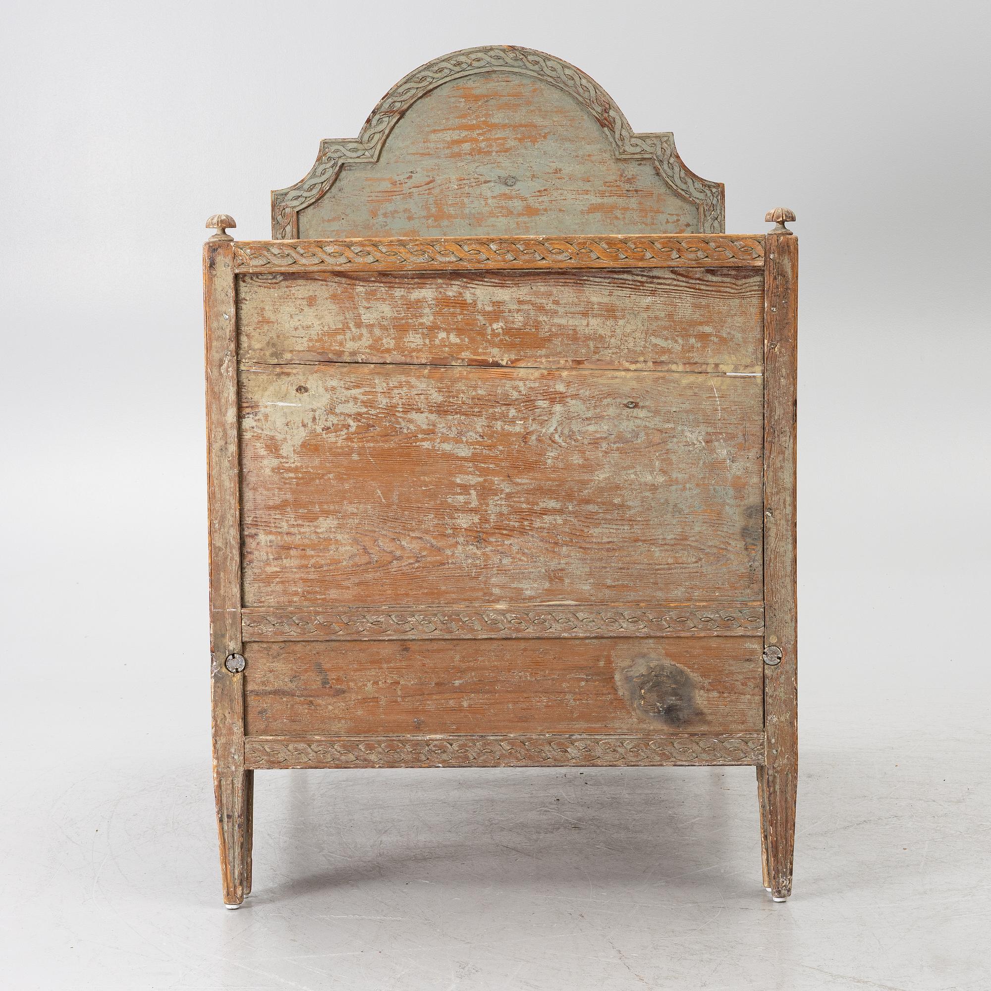 A Gustavian carved bedframe, late 18th century.