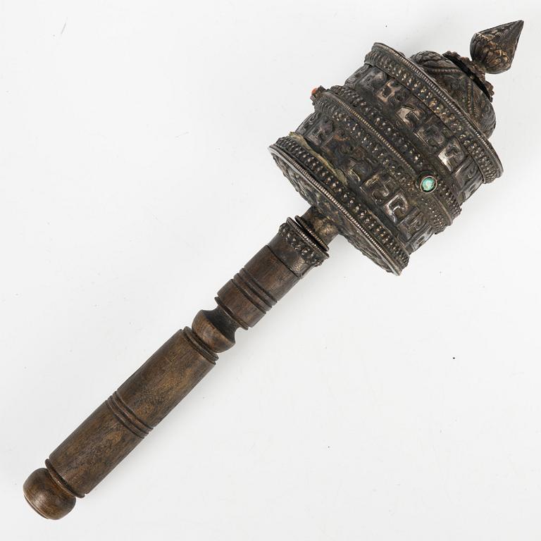 A Tibetian prayer wheel and three bronze opium weights, probably Burma.