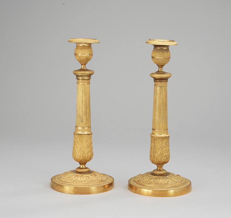 A pair of French Empire early 19th Century candlesticks.