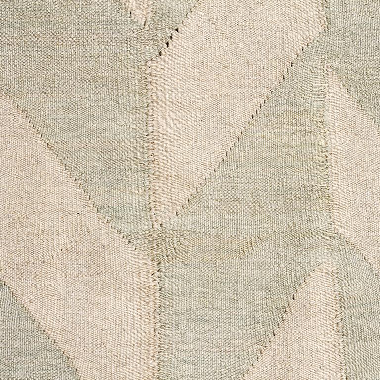 A flatweave rug, 307 x 250 cm.