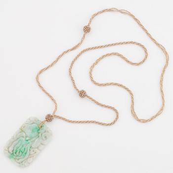 A most likely jade pendant with pearls.