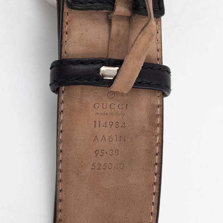 Gucci, a black leather belt, size 95.