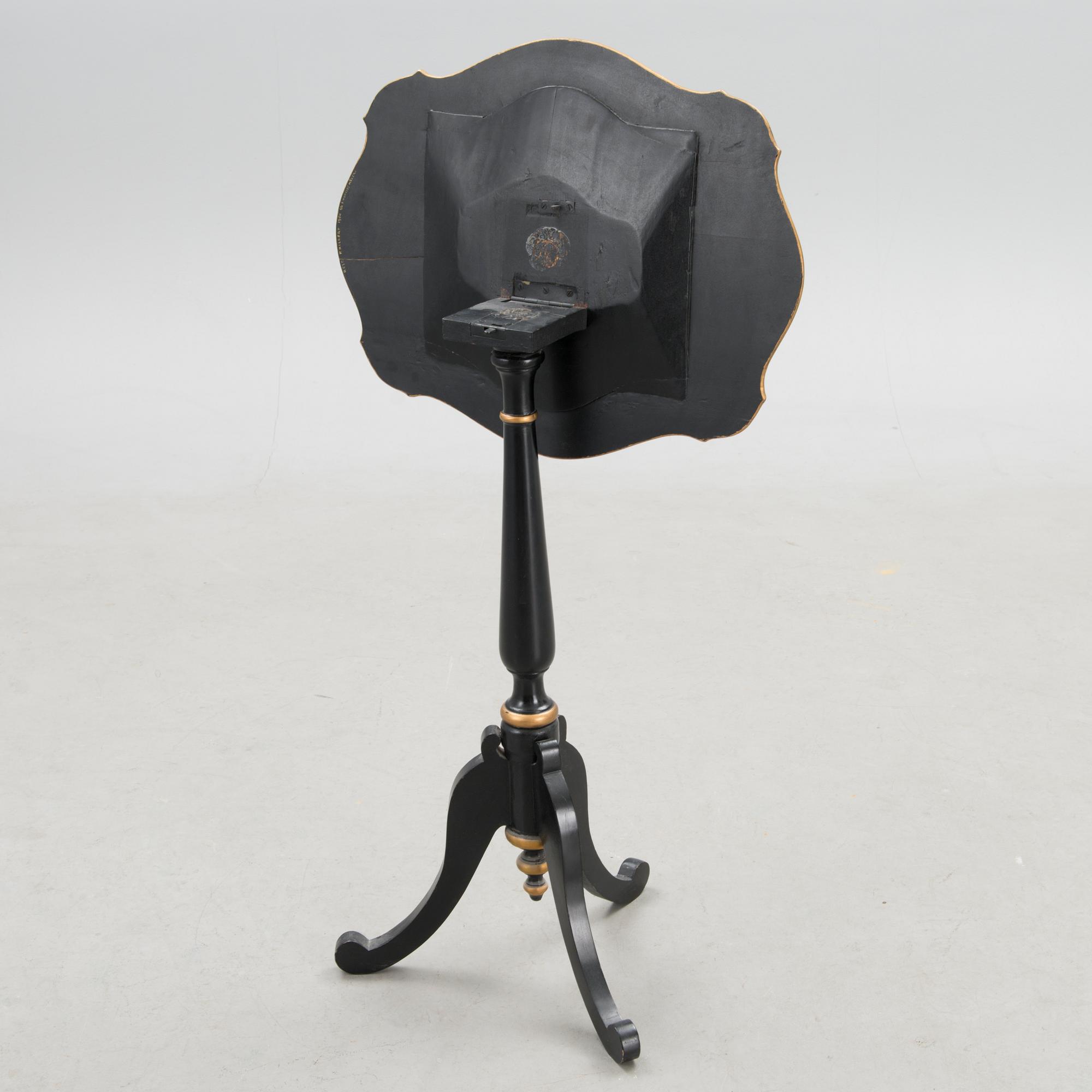 A Chinese tilt top chess table from the first half of the 20th century.