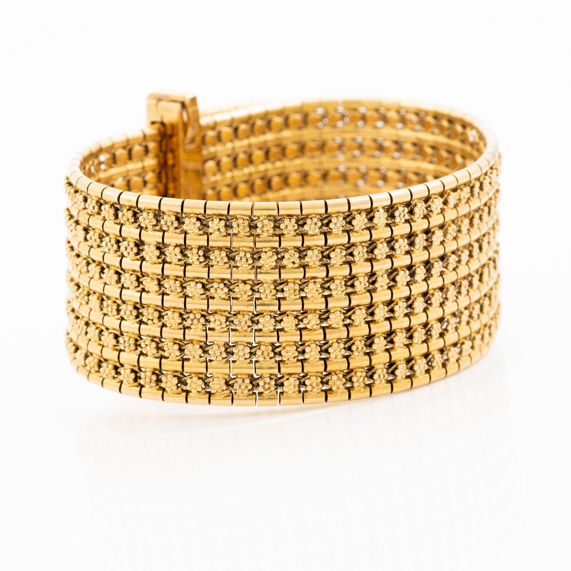 Armband 18K guld med tofs, 1900-talets andra hälft.