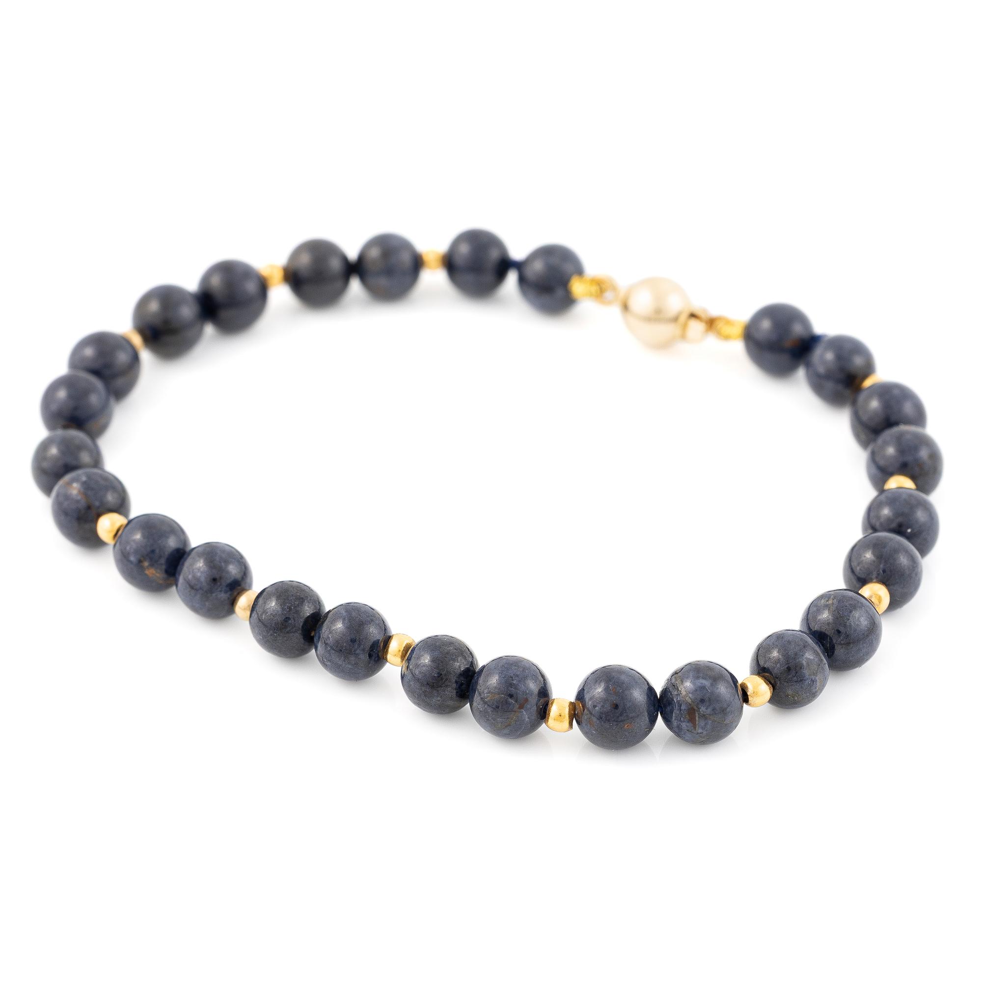 Bracelet with blue stones and 18K gold clasp.