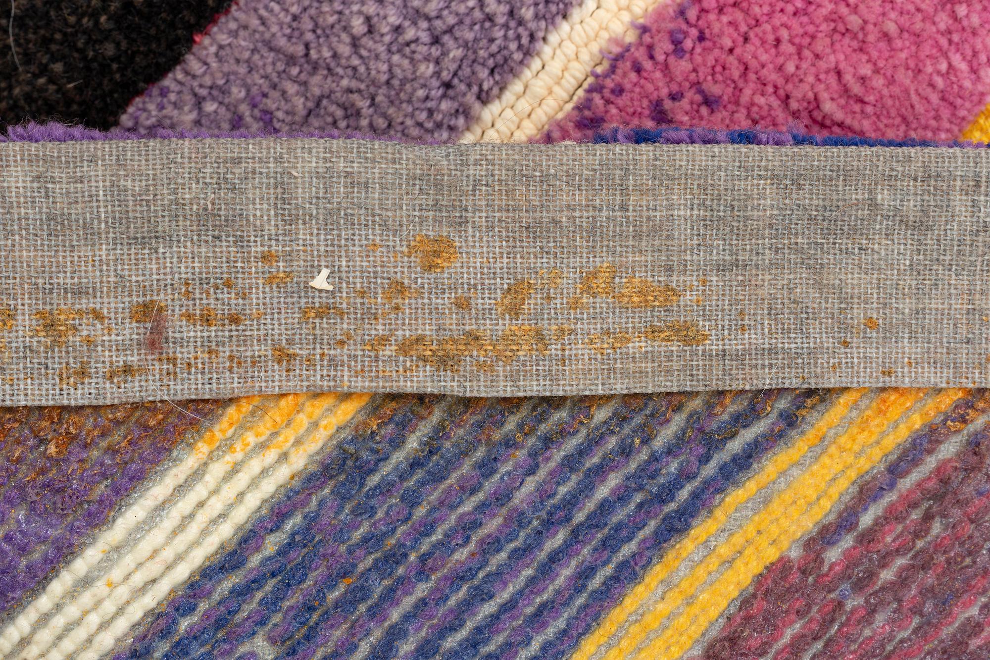 A carpet, 'Océjan', tufted (in relief), Kasthall, Sweden, c. 700 x 170 cm, signed 'JM 83'.