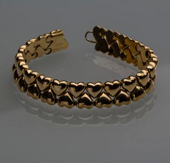 ARMLÄNK, 18 k guld, Cartier. Vikt ca 42 g.