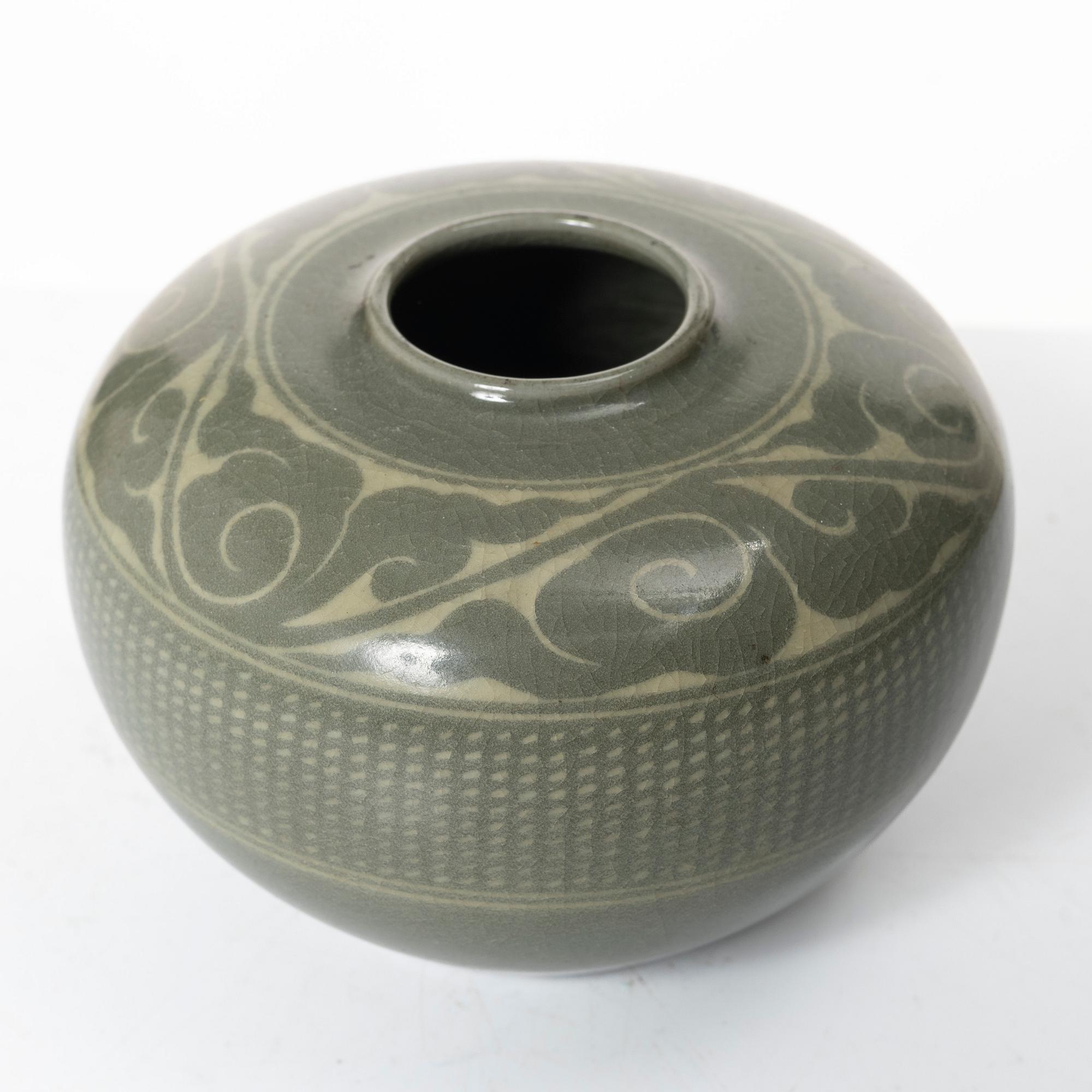 A Korean celadon glazed ceramic vase, 1900s.