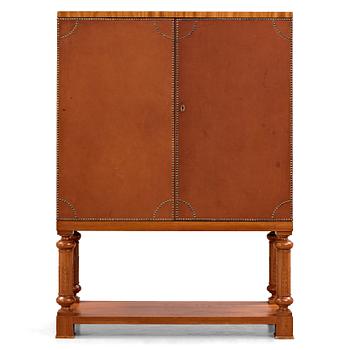 170. Otto Schulz, Boet, Gothenburg, probably, a cabinet covered with brown leather, dated 1942.