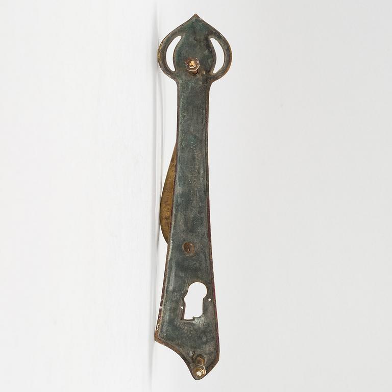 An early 20th century art nouveau doorhandle, France.