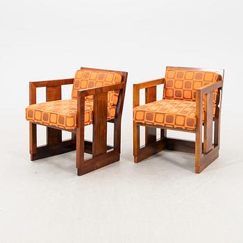 A pair of similar stained wood art déco armchairs from the first half of the 20th century.