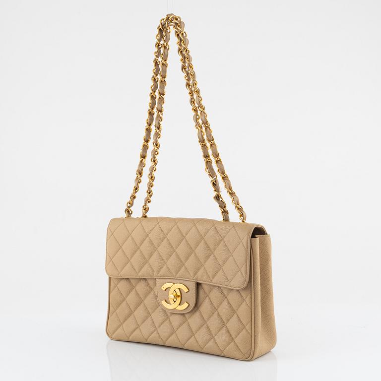 Chanel, a beige 'Caviar Jumbo Classic Flap Bag', vintage.
