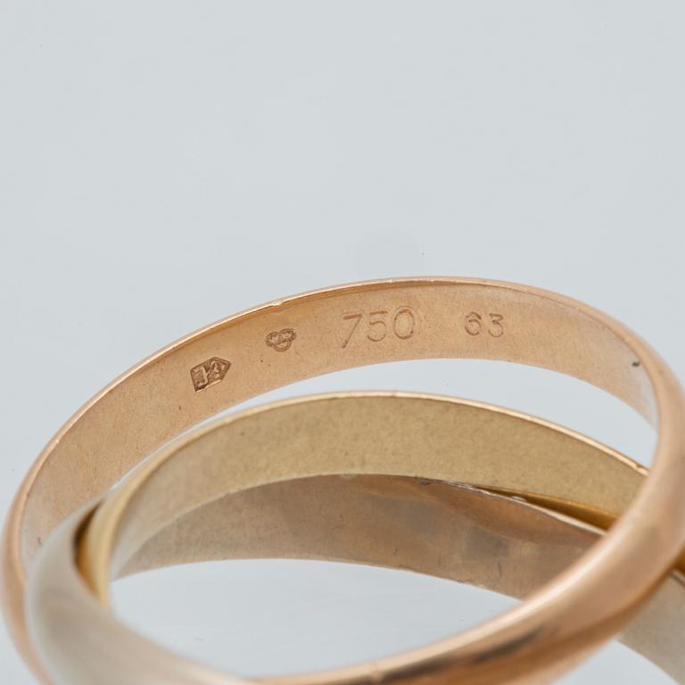 An 18K tri-coloured "Trinity" gold ring by Cartier.