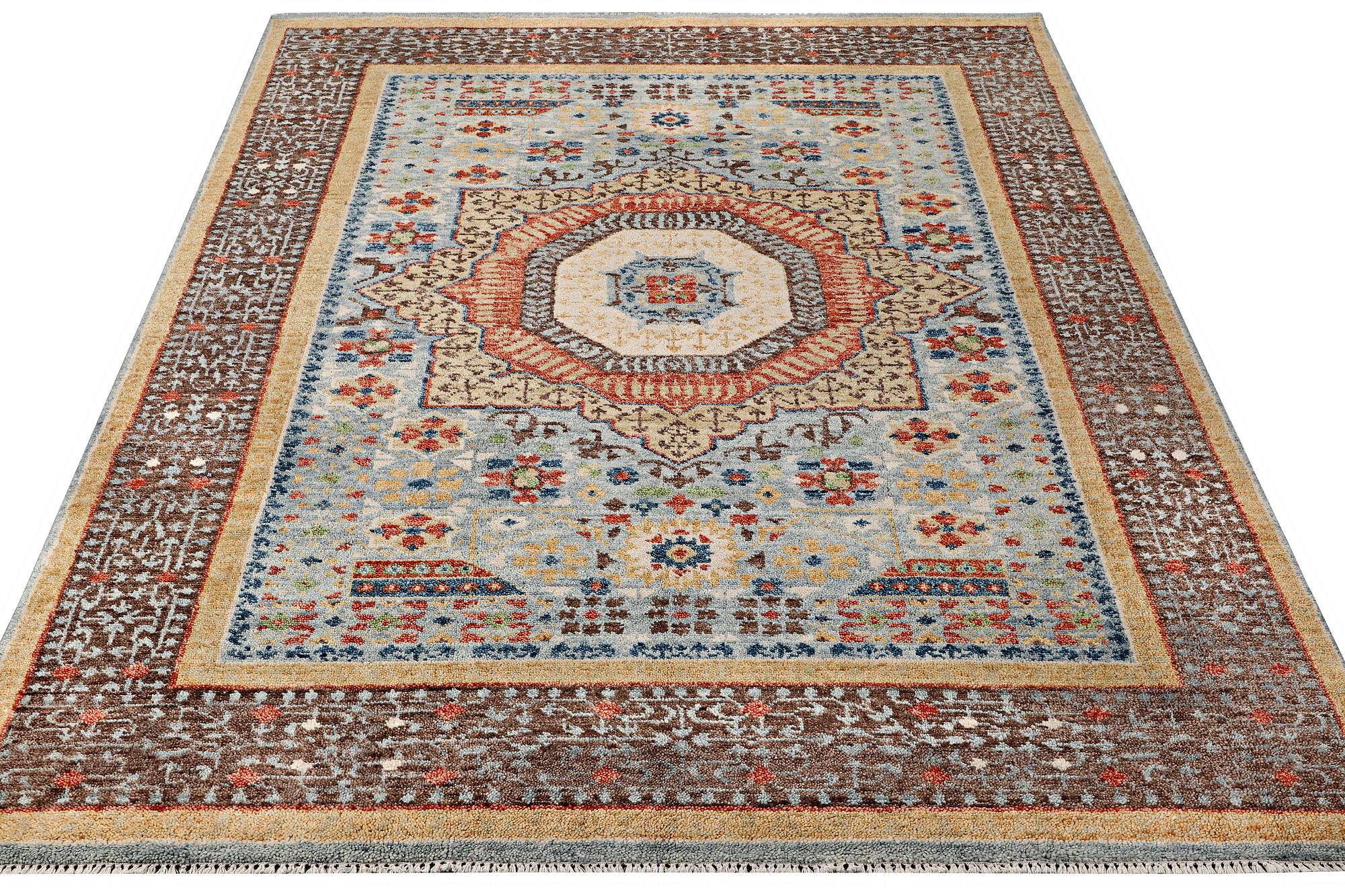 An oriental carpet with Mamluk design, c. 356 x 255 cm.