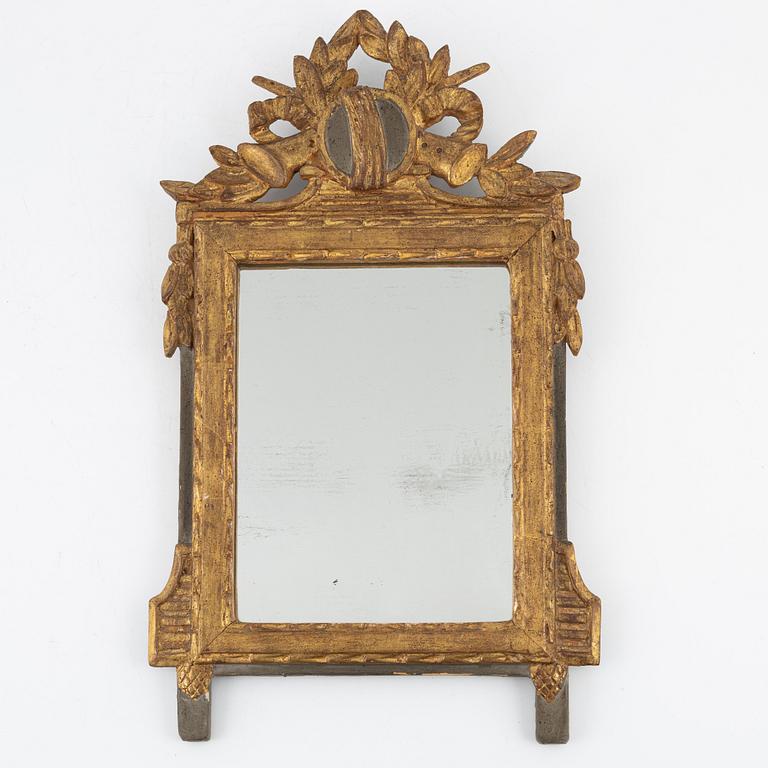 A Gustavian style mirror, around the year 1900.