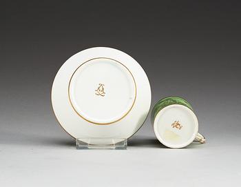 A green ground Sèvres cup and saucer, 18th Century.