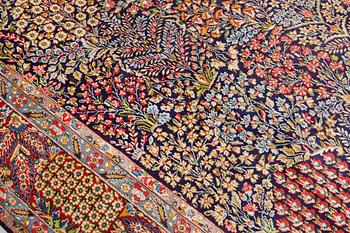 A 'Millefleur' Kerman Laver carpet, c. 402 x 284 cm.