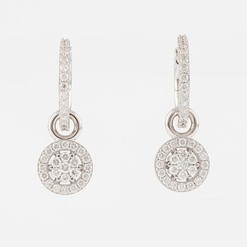 A pair of 18K gold earrings with round brilliant-cut diamonds.