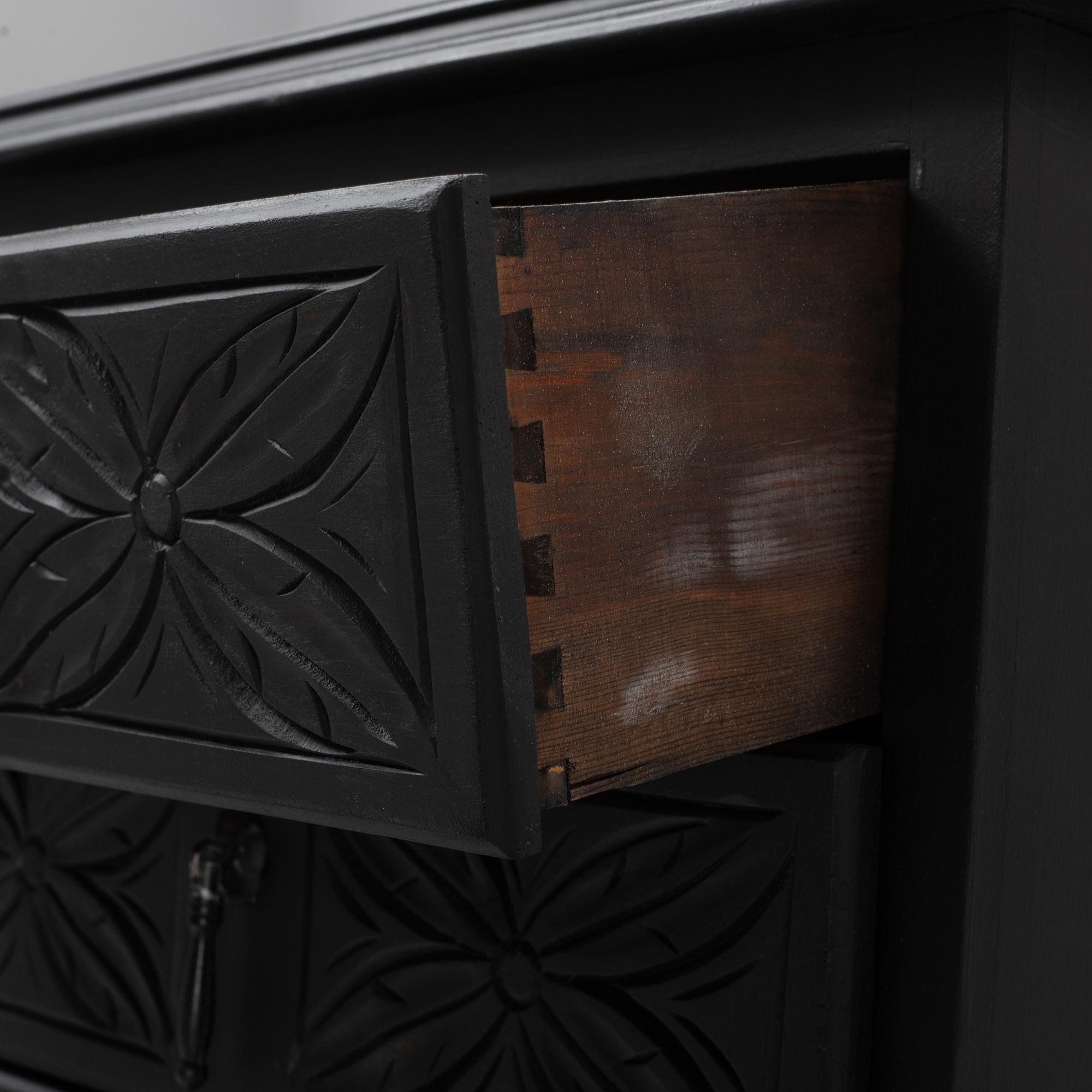A carved and painted chest of drawers, late 20th Century.