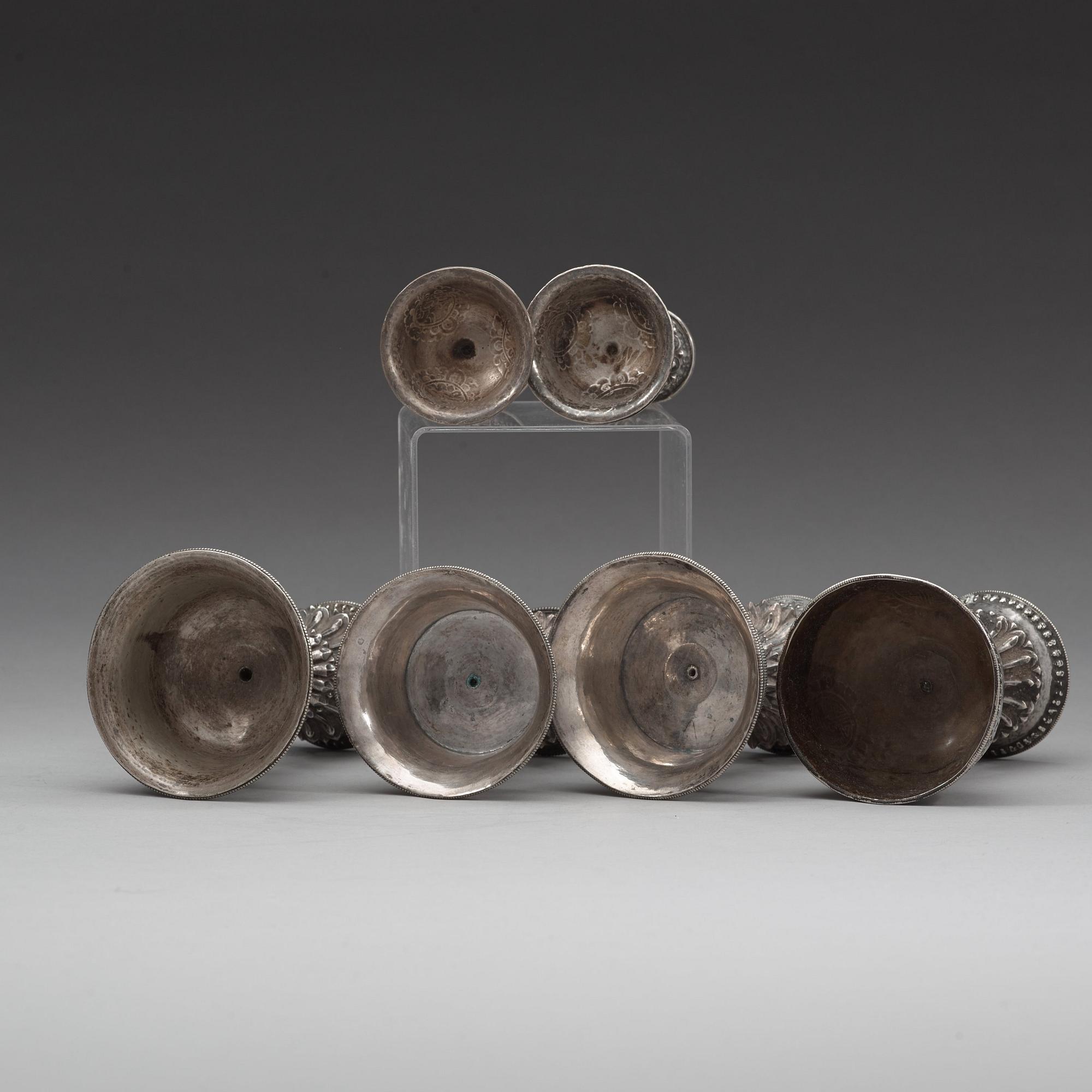 A group of six Tibetan silver/silvered Butter lamps, 19th Century.