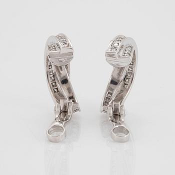 A pair of Cartier "Trinity" earrings in 18K white gold set with round brilliant-cut diamonds.