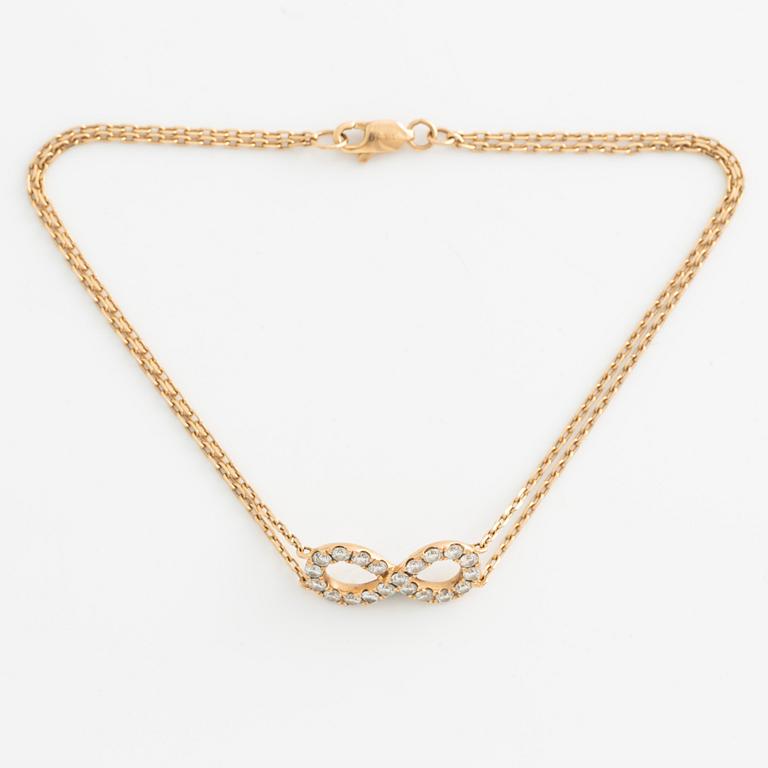 Armband, 18K guld med briljantslipade diamanter.