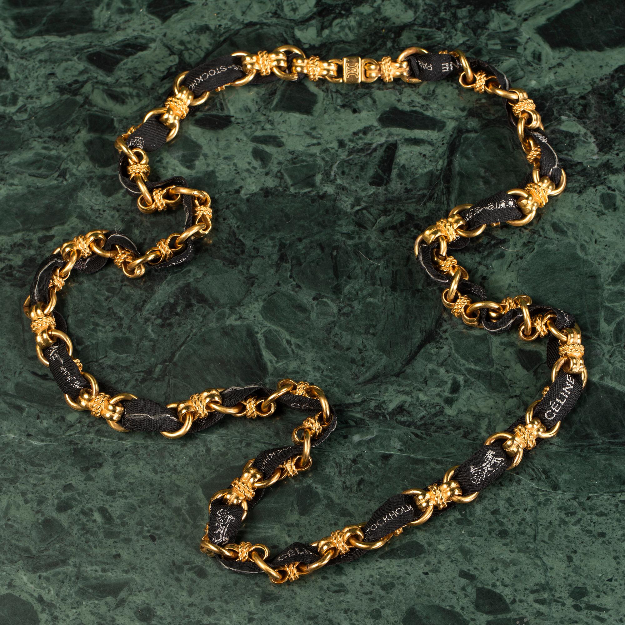 A necklace by CÉLINE.