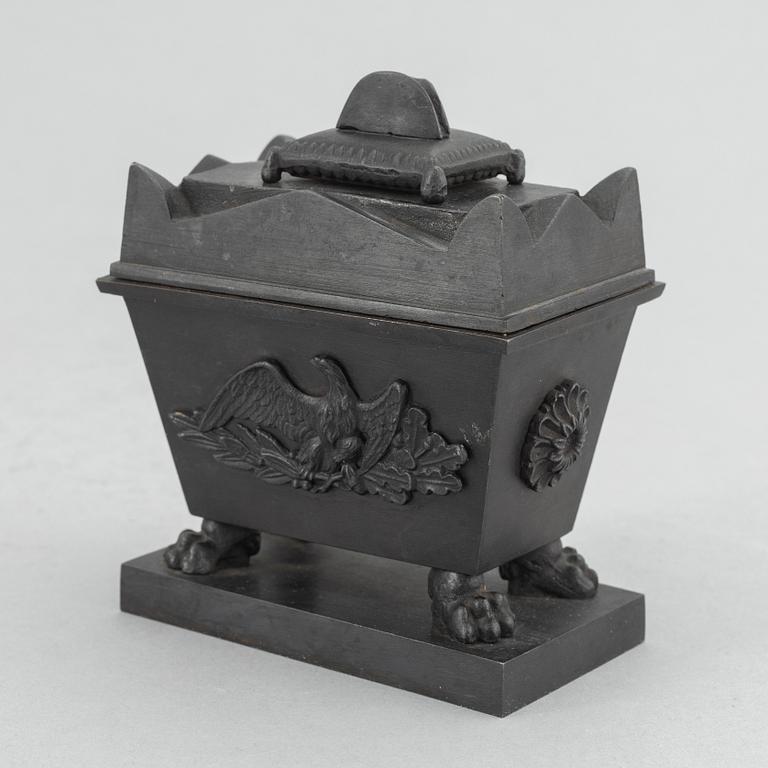 A cast iron inkwell in the form of the sarcophagus of Napoleon, Königliche Preußische Eisengießerei, Berlin, ca. 1815-20.