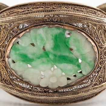 A silver and stained nephrite bracelet.