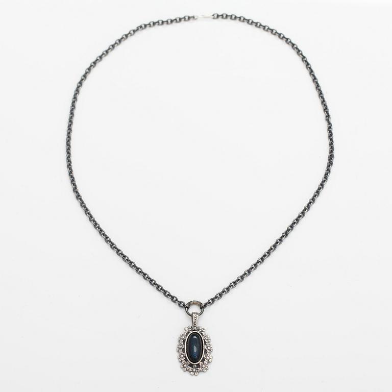 Jorma Laine, A silver necklace "Lemmikki" witha spectrolite. Turun Hopea, Turku.