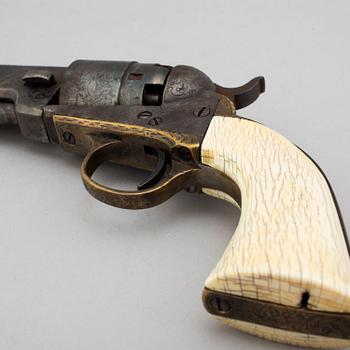 A Colt 1862 Pocket Navy percussion revolver with ivorygrip.