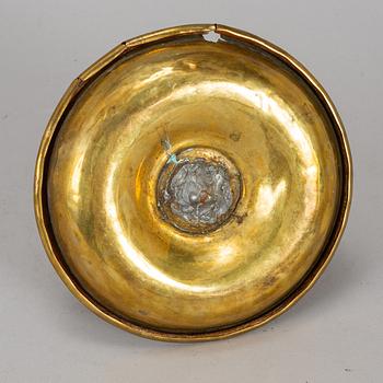 A 19th century brass night light holder.