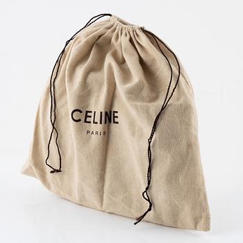 Céline, a blue leather bag.