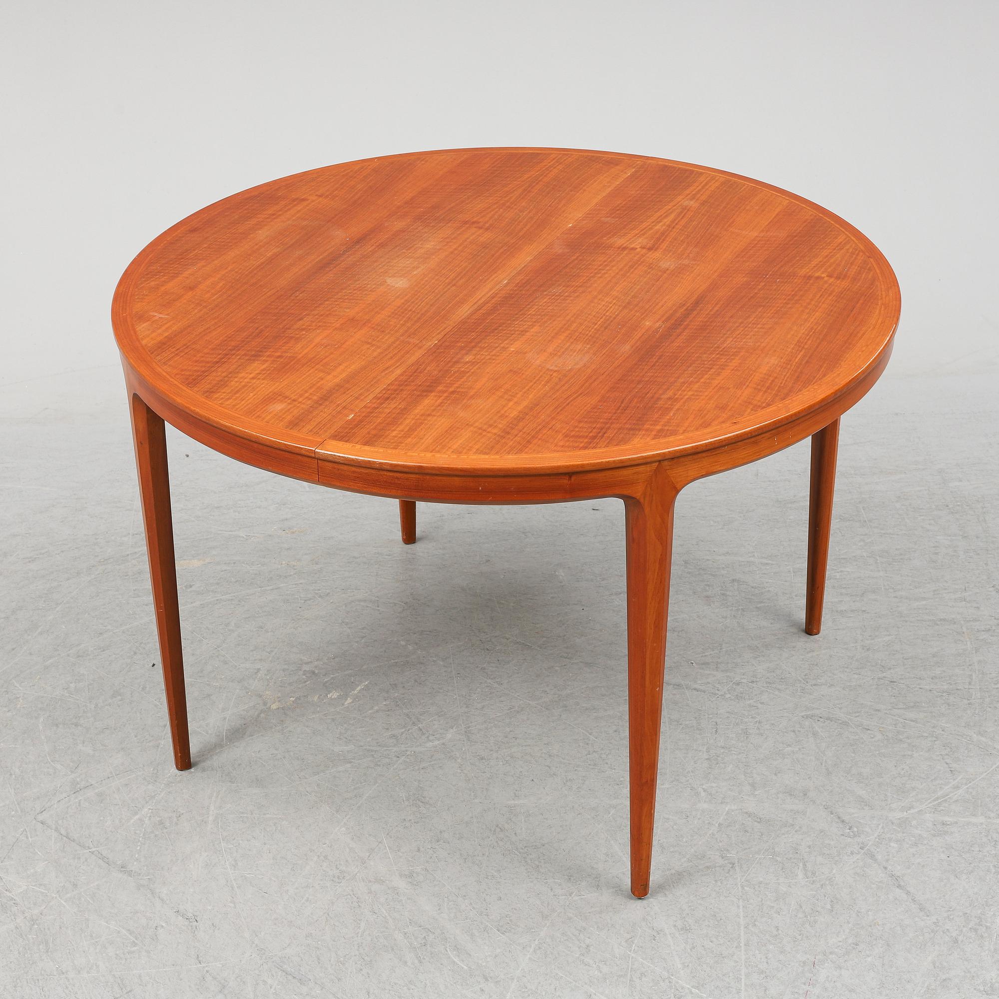 BERTIL FRIDHAGEN, a seven  piece walnut dining suite from Bodafors.