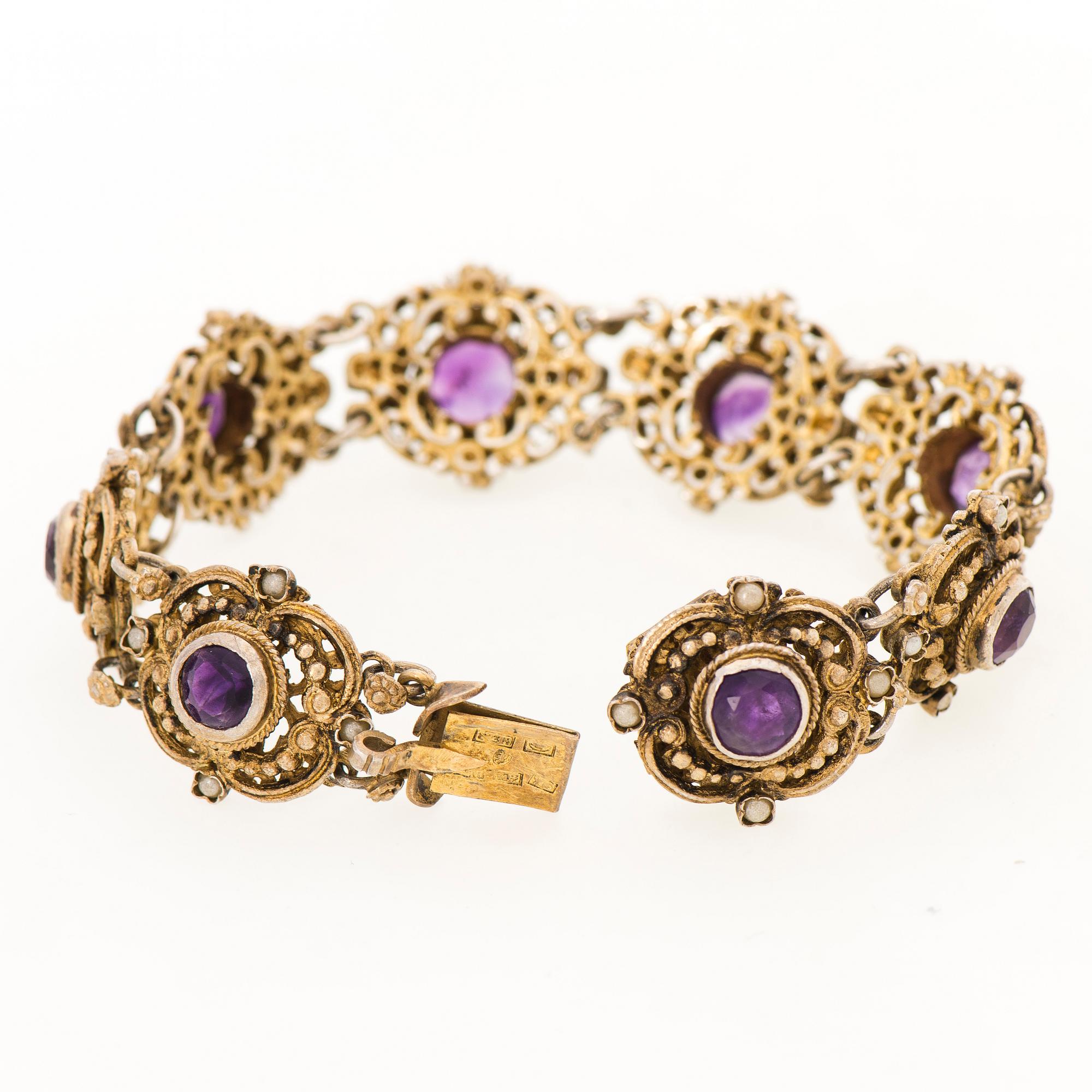 A BRACELET, goldplated silver, amethysts, pearls. Import marks, Kulta-Kontu, Helsinki Finland 1952.