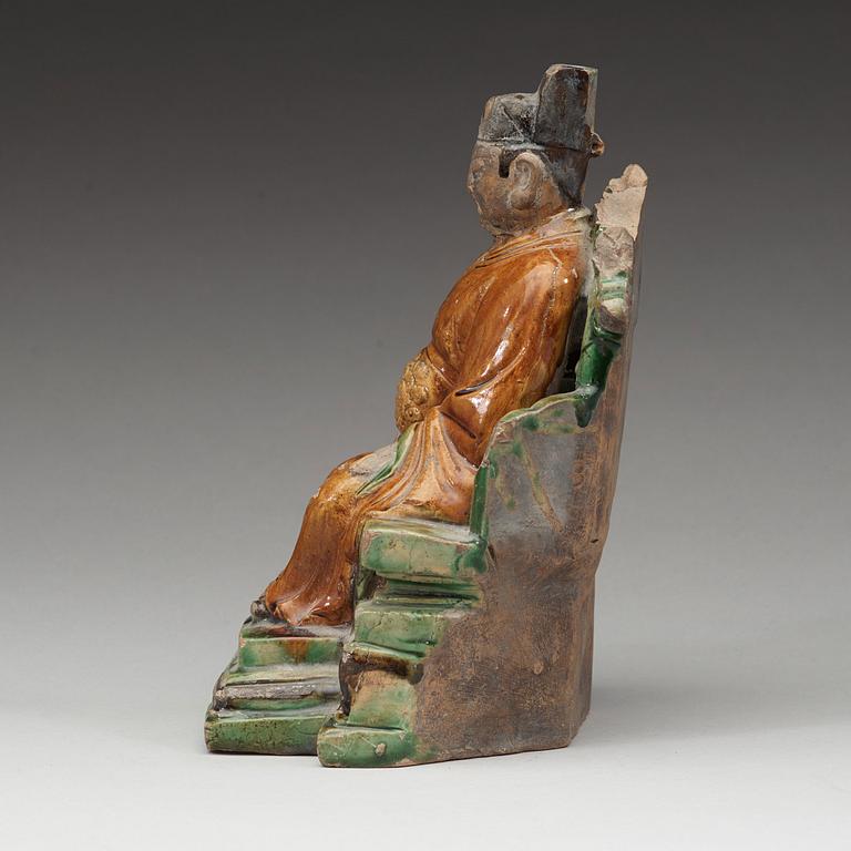 A ceramic sculpture of a seated daoist dignitary, Ming dynasty, (1368-1644).