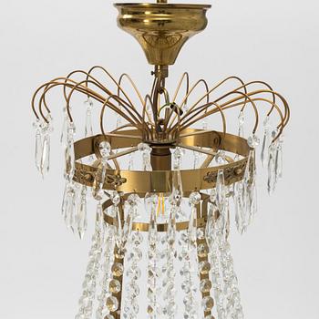 A contemporary Empirestyle chandelier for eight candles.