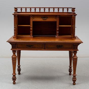 A late 19th century writing desk and armchair.