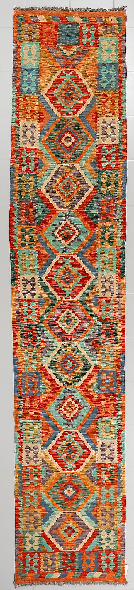 A kelim runner, ca 398 x 76 cm.