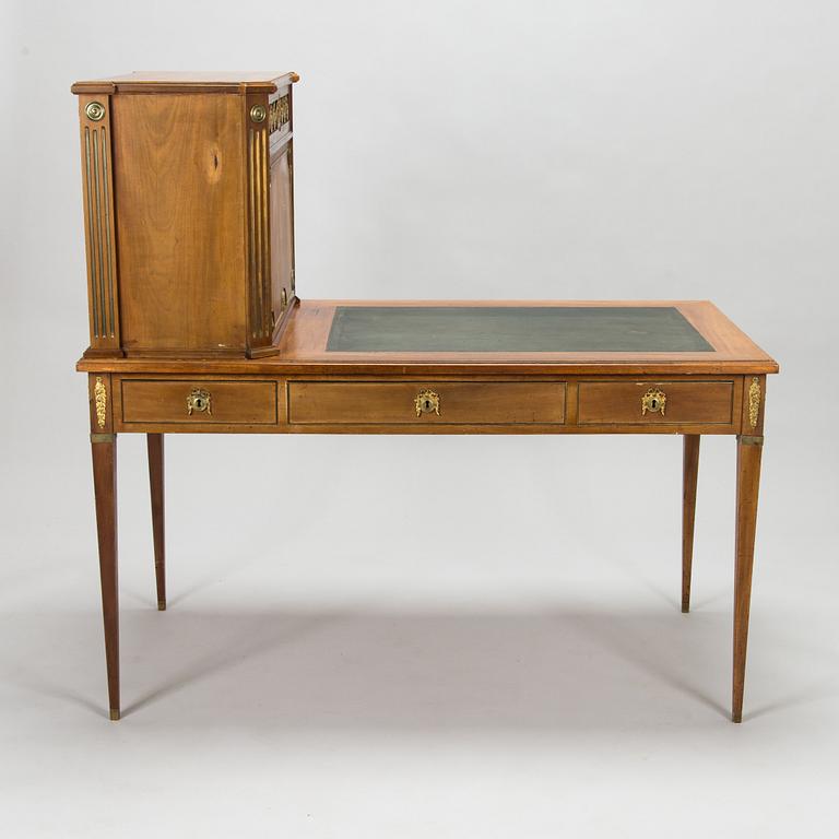 A 20th-century Louis XVI style mahogany veneered writing desk.